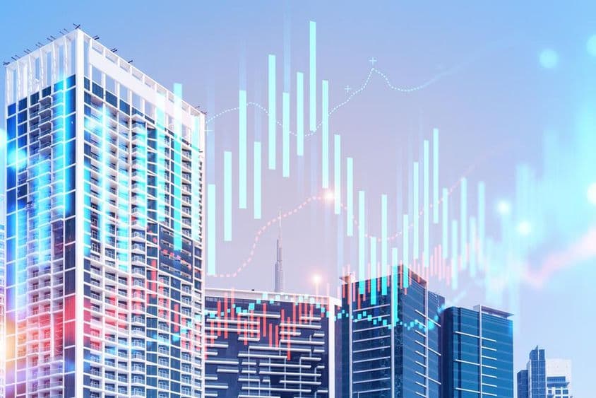 Edificios con el Burj Khalifa detrás y gráficas al frente.