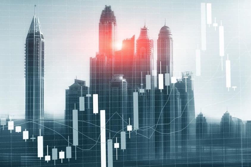 Gráfico del mercado de valores con rascacielos de Dubái en el fondo.